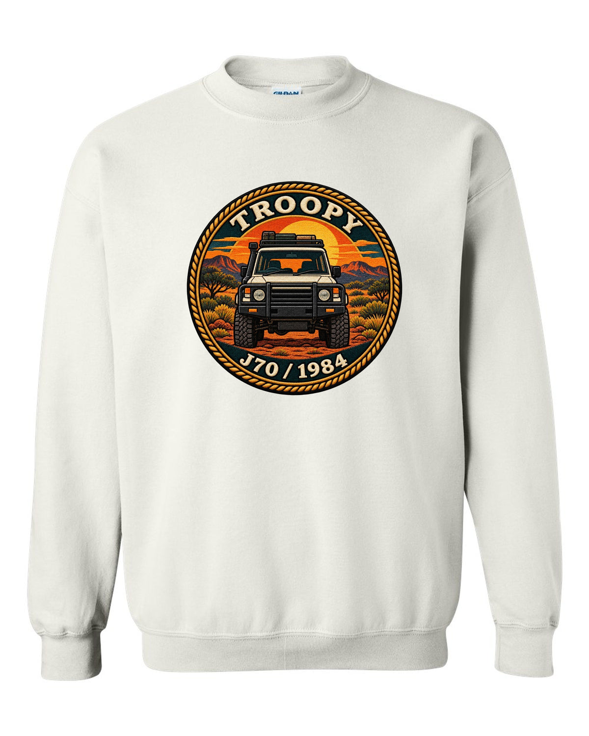 Sunset stamp patch crest of a Toyota Land Cruiser J70 troop carrier with the word Troopy white crewneck front view with the design