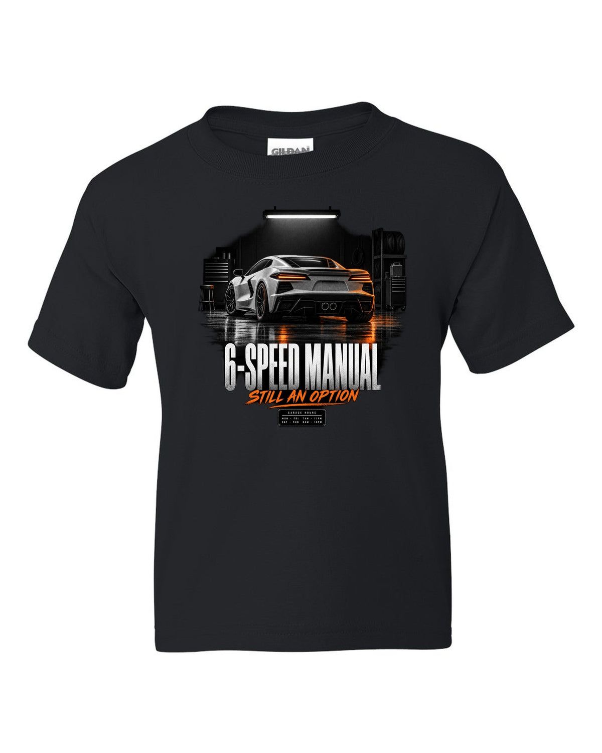 Lotus Emira V6 in a garage at night with 6-speed manual text black kids tee front view with the design