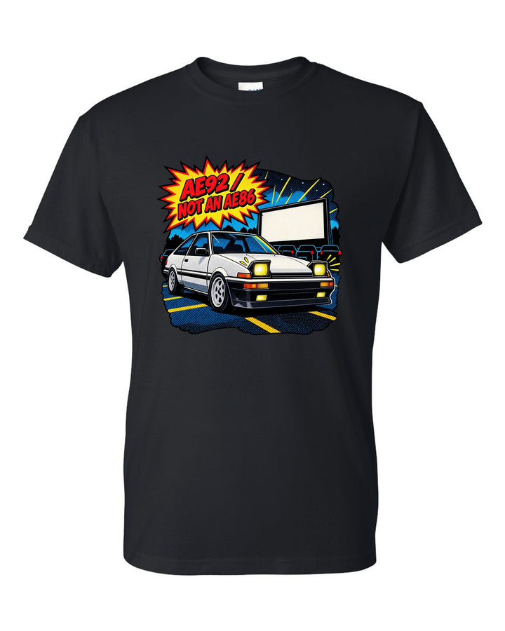 Comic halftone pop-art of a Toyota Corolla AE92 Trueno with the text AE92 Not an AE86 black t-shirt front view with the design