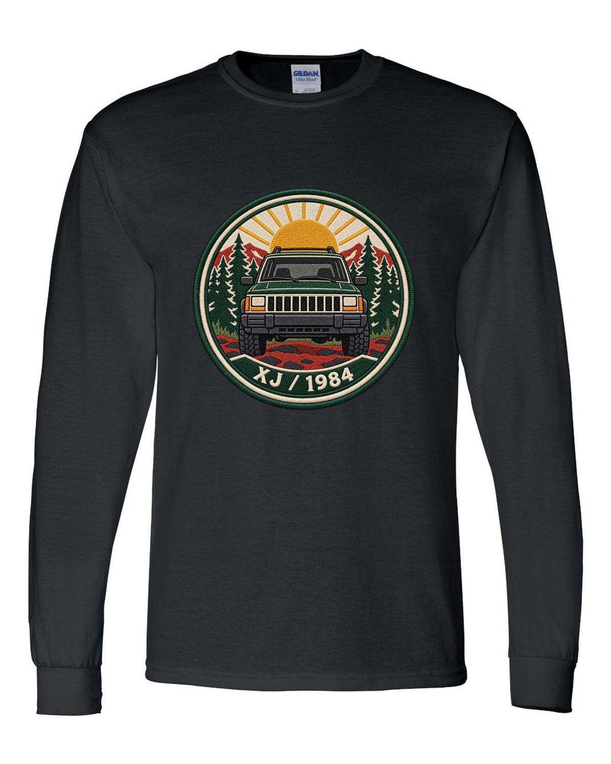 Round embroidered-style crest print of a boxy Jeep Cherokee XJ with XJ 1984 text black long sleeve front view with the design