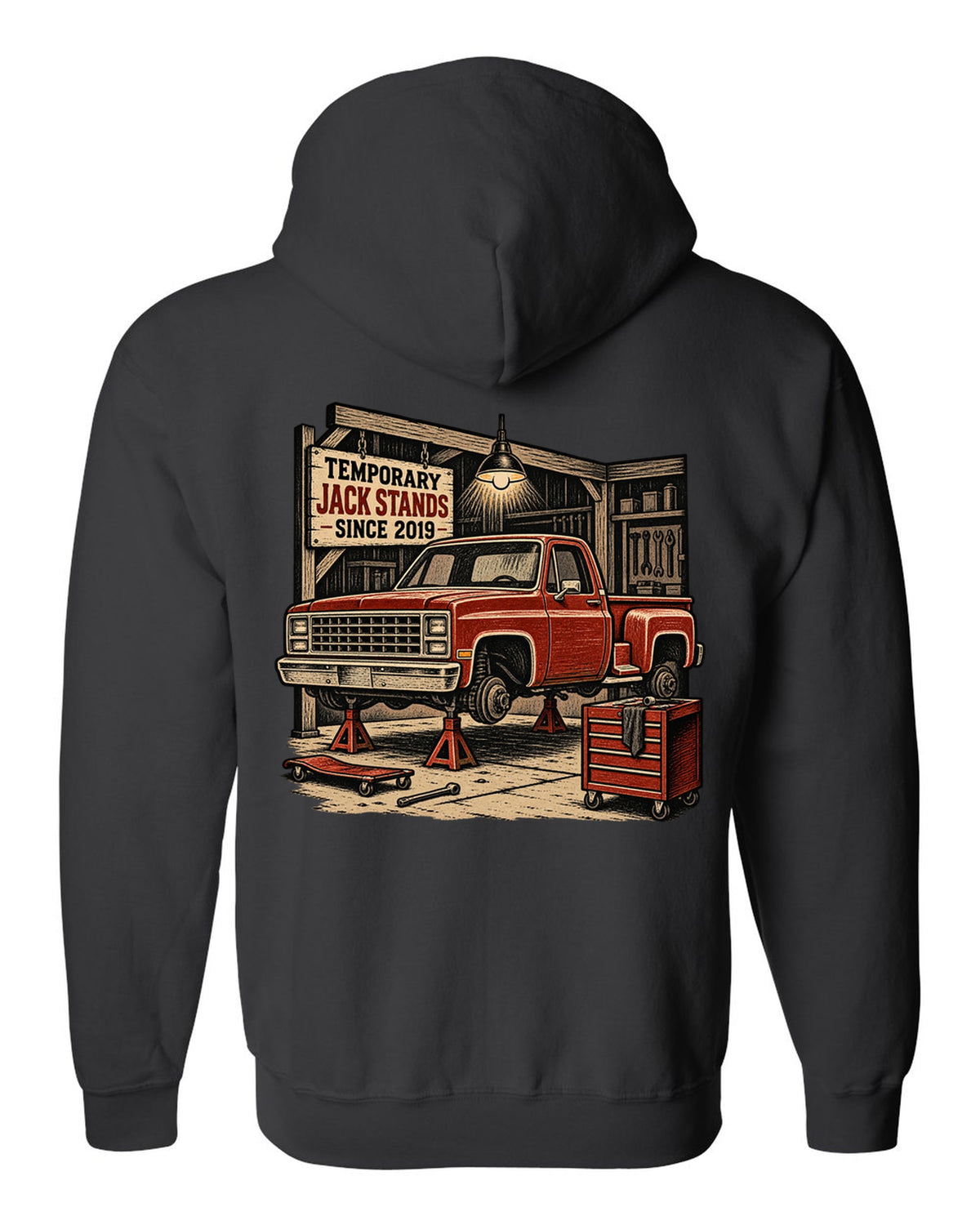 Linocut woodcut style print of a 1973-87 Chevrolet C10 Squarebody Stepside in a workshop with jack stands lettering black zip hoodie back view with the design