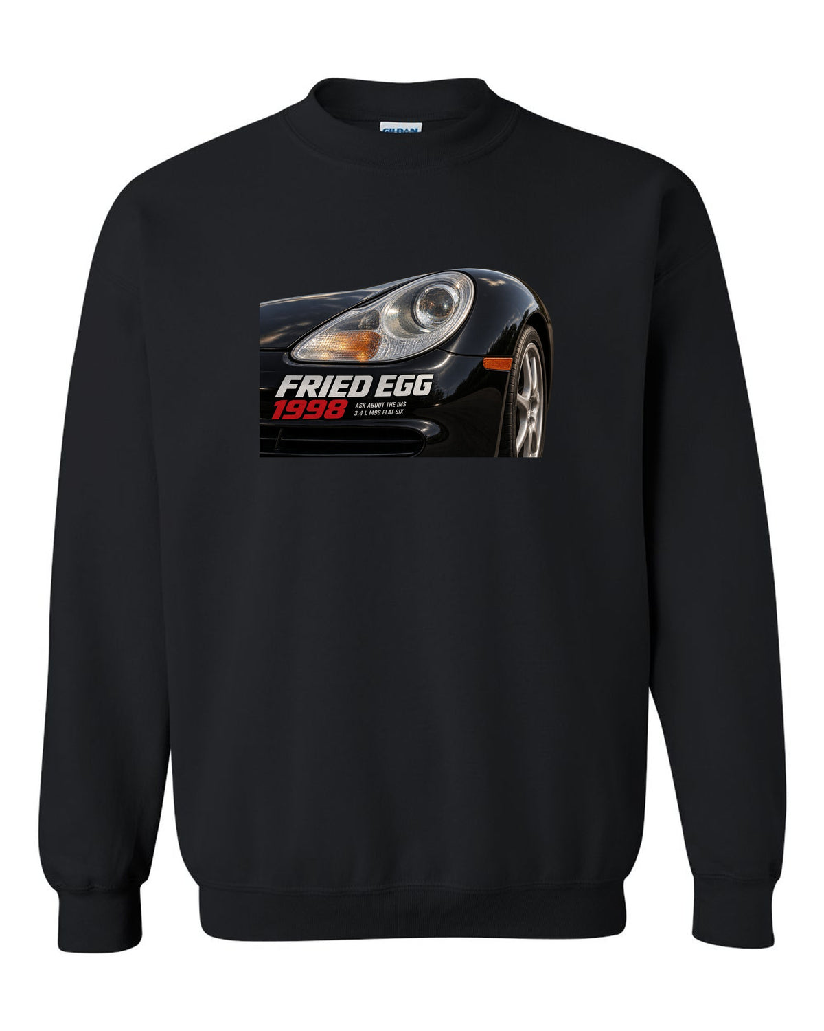 Close-up detail print of the Porsche 911 996 Fried Egg lamp with IMS joke text black crewneck front view with the design