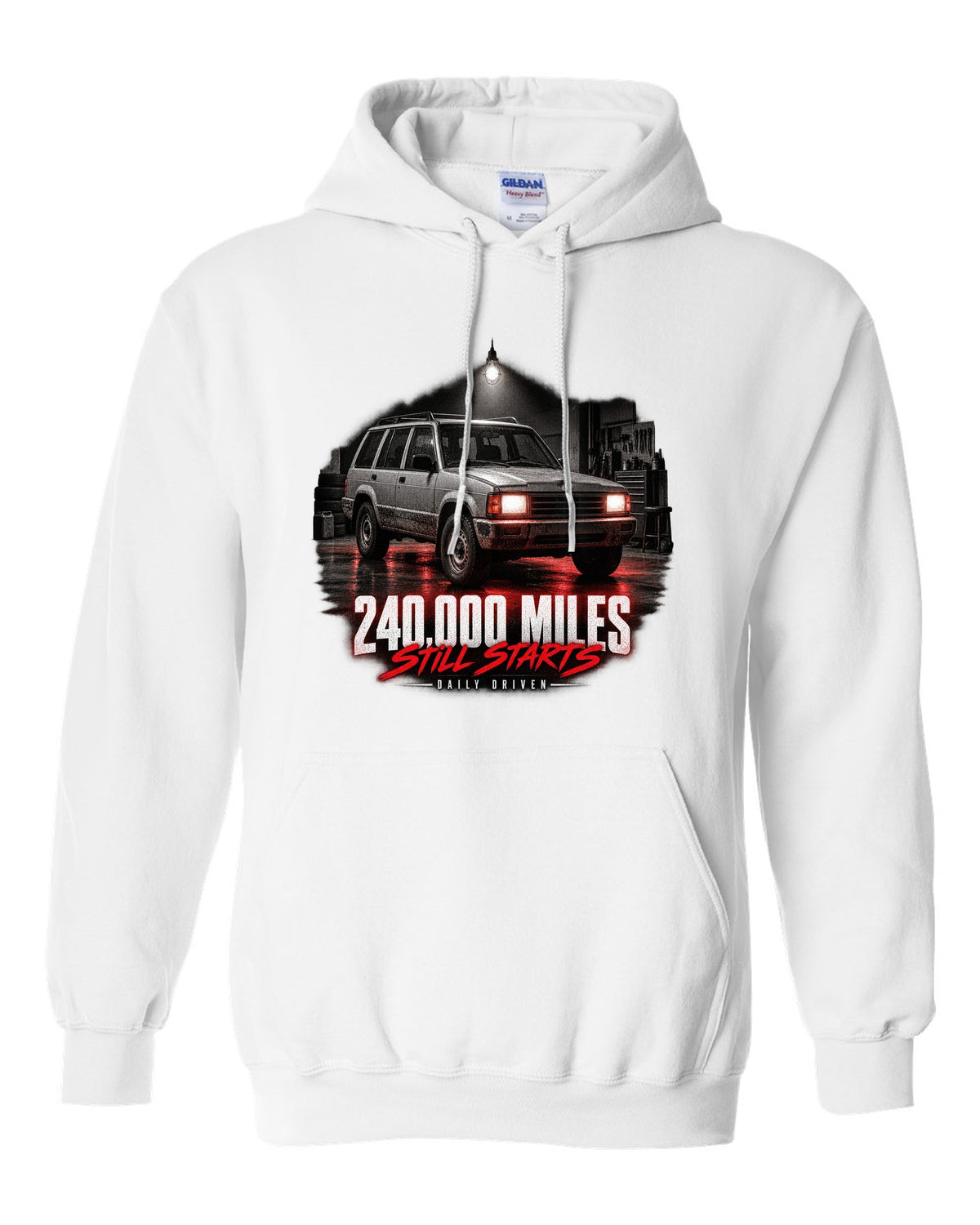 Jeep Cherokee XJ at night with daily driven 240,000 miles print white pull over hoodie front view with the design