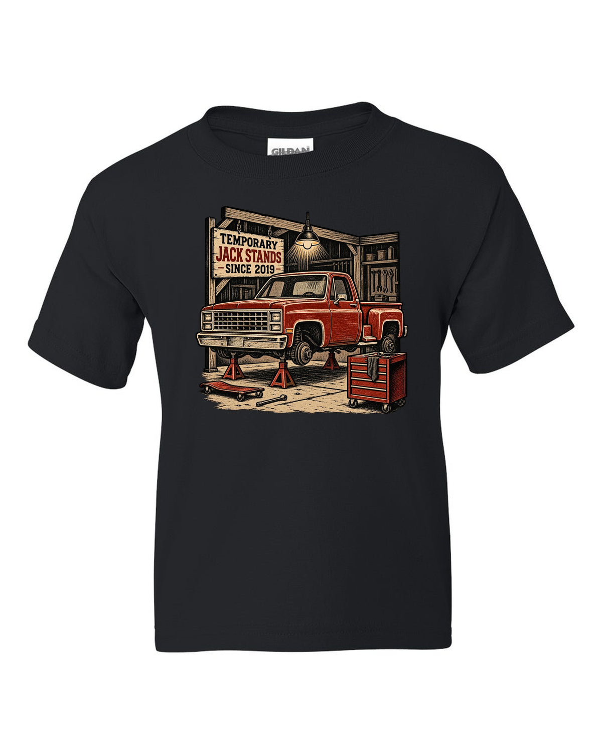 Linocut woodcut style print of a 1973-87 Chevrolet C10 Squarebody Stepside in a workshop with jack stands lettering black kids tee front view with the design