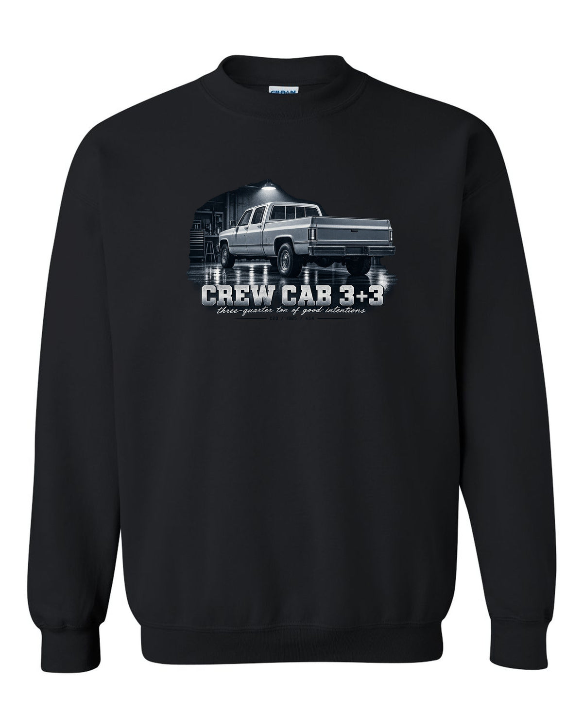 1985 C20 Squarebody crew cab in a garage night scene, print black crewneck front view with the design