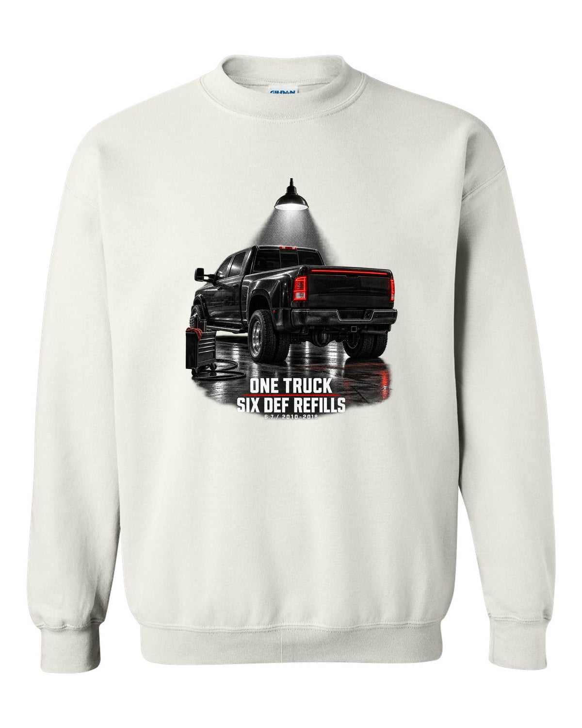Ram 3500 4th gen dually 6.7 in a night garage with the text One truck, six DEF refills white crewneck front view with the design