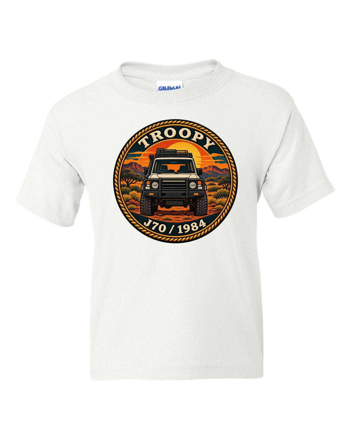 Sunset stamp patch crest of a Toyota Land Cruiser J70 troop carrier with the word Troopy white kids tee front view with the design