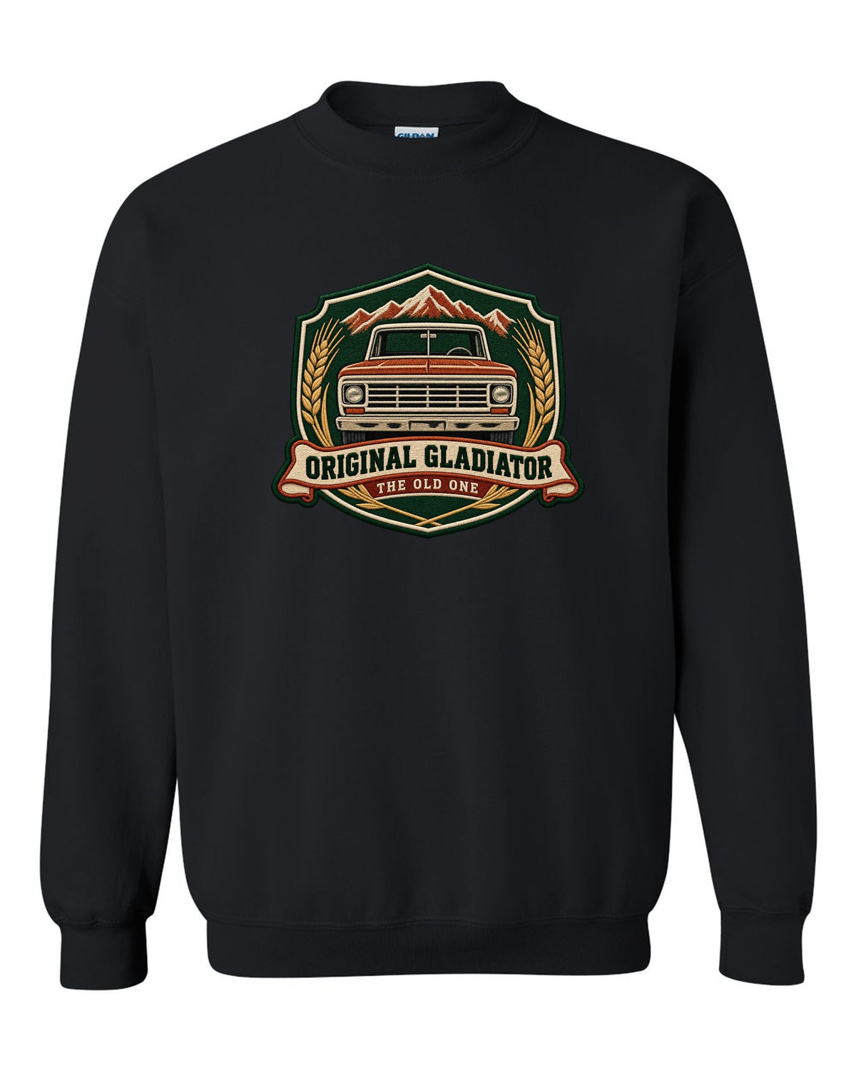Embroidery-style shield crest print with Jeep Gladiator J-series pickup and the words The Old One black crewneck front view with the design