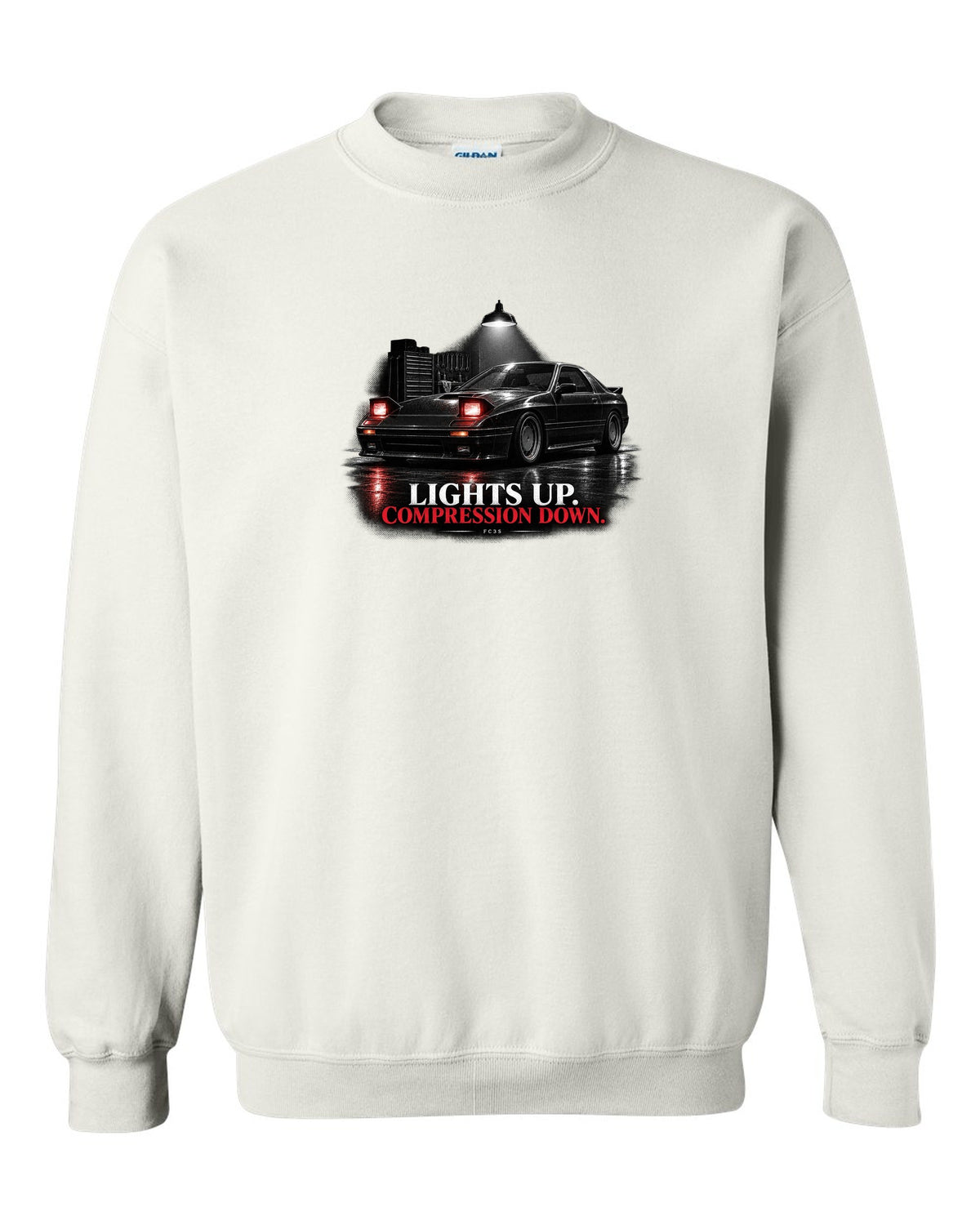 Low front three-quarter Mazda RX-7 FC3S Turbo II in a garage at night white crewneck front view with the design