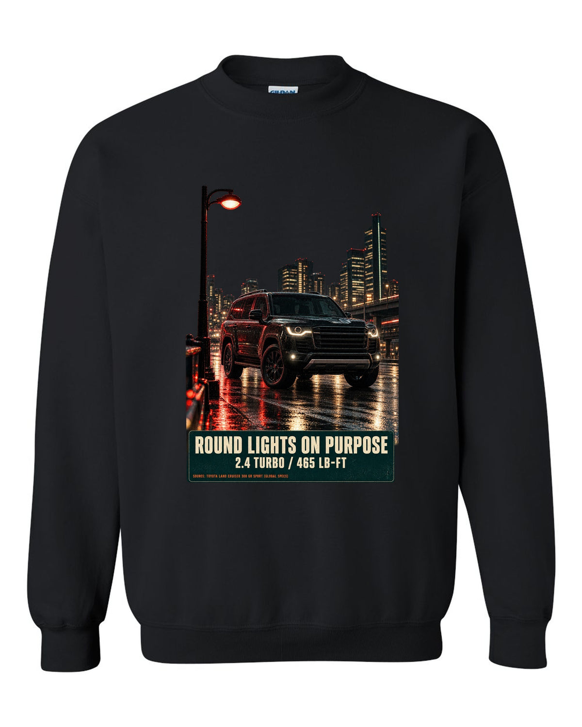 Toyota Land Cruiser 250 First Edition on a mountain pass at night black crewneck front view with the design