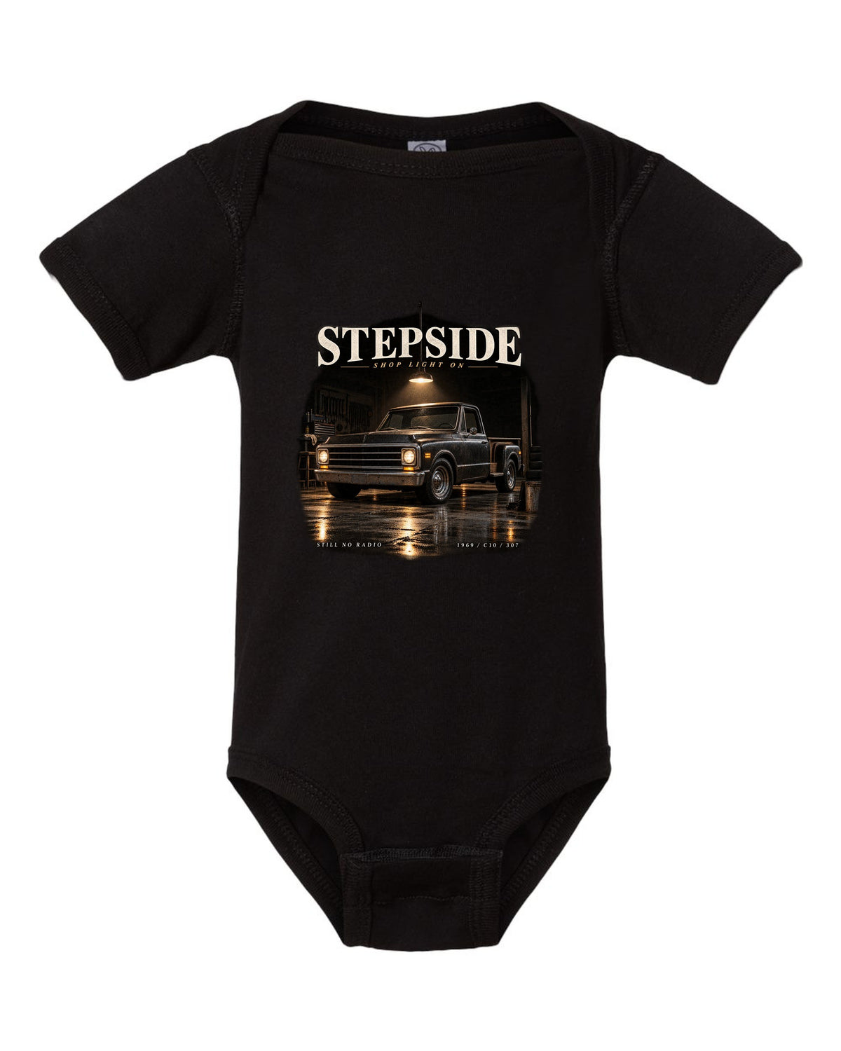 Chevy C10 Stepside under a shop light, garage night print black baby onesie front view with the design