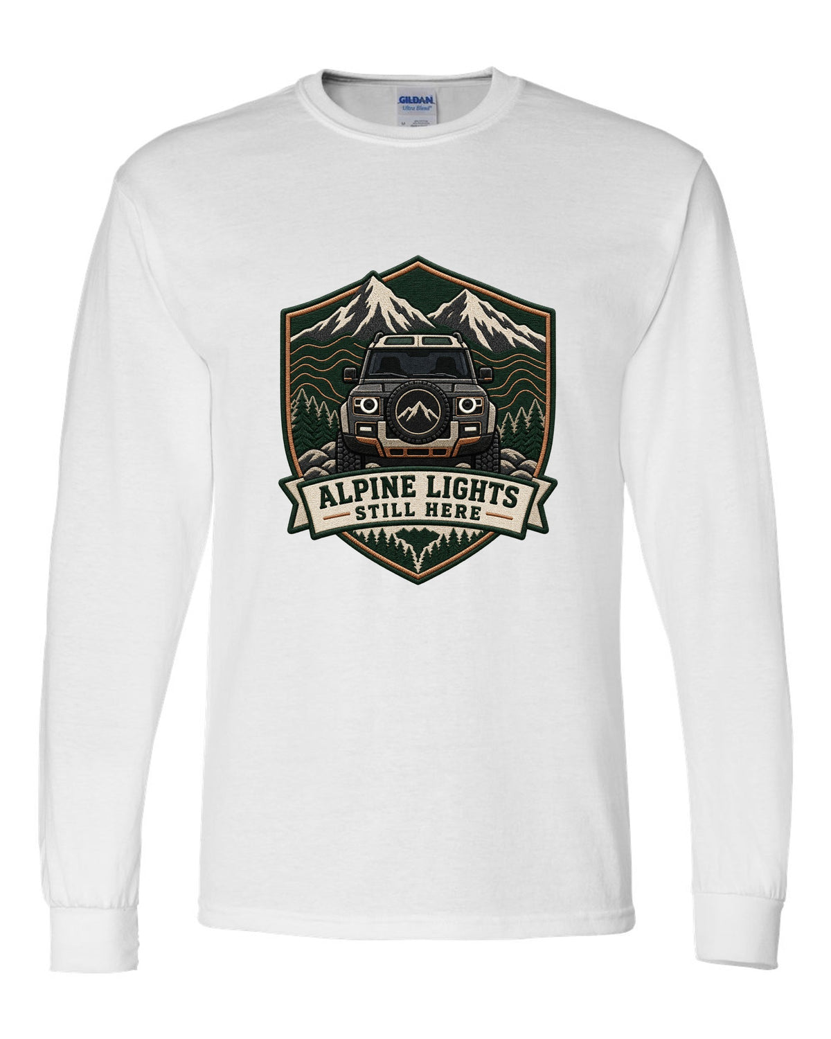 Original shield crest print for a Land Rover Defender L663 with Alpine Lights Still Here text white long sleeve front view with the design