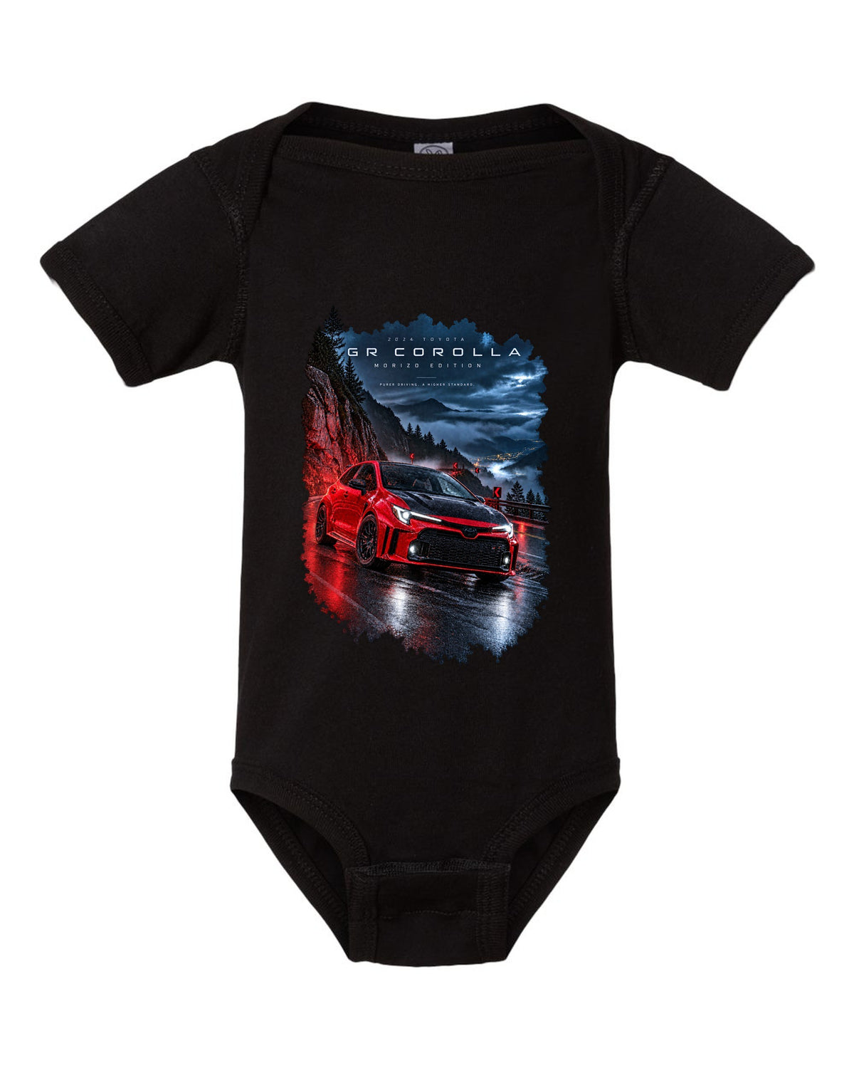 Toyota GR Corolla Morizo Edition on a wet mountain road at night black baby onesie front view with the design