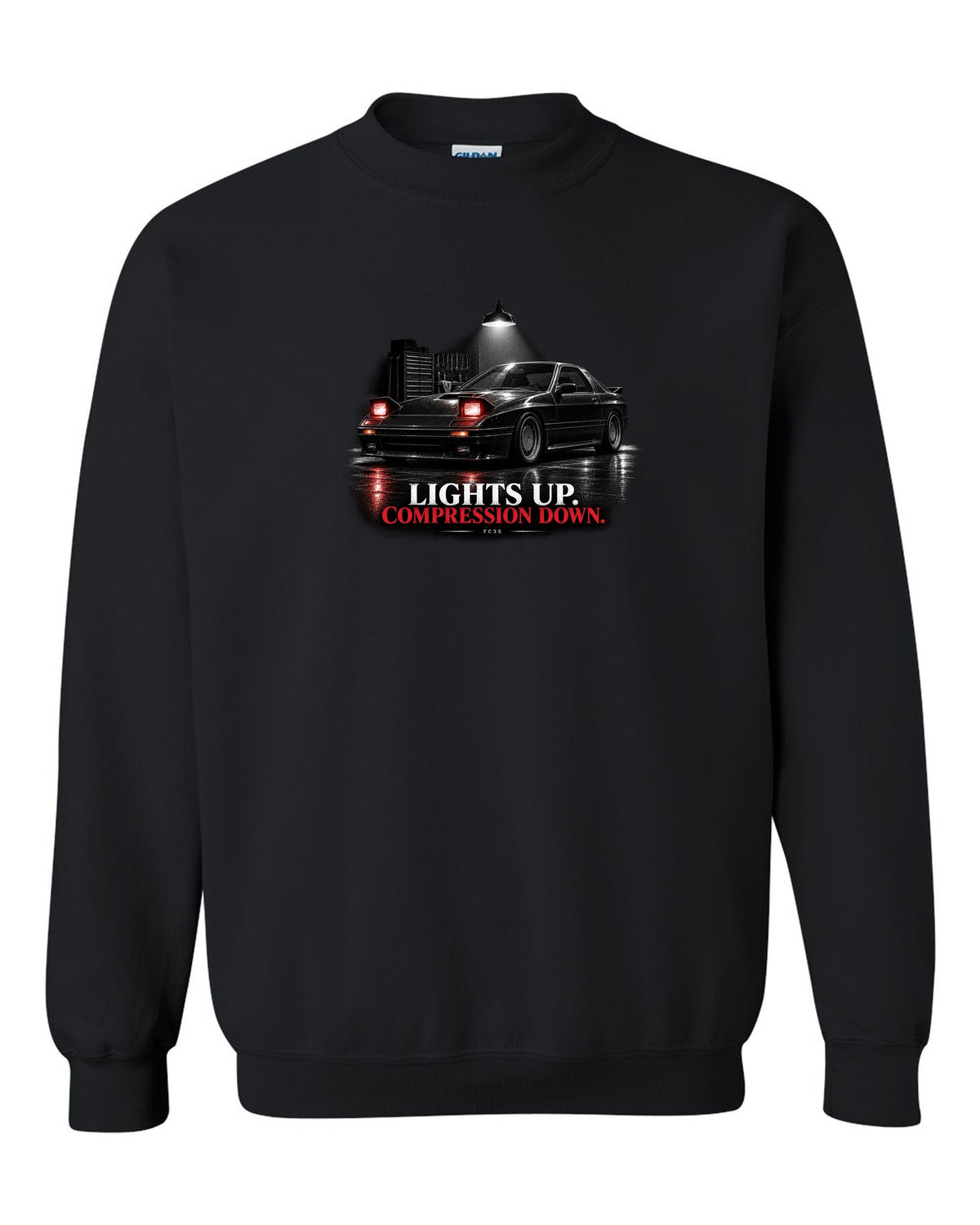 Low front three-quarter Mazda RX-7 FC3S Turbo II in a garage at night black crewneck front view with the design