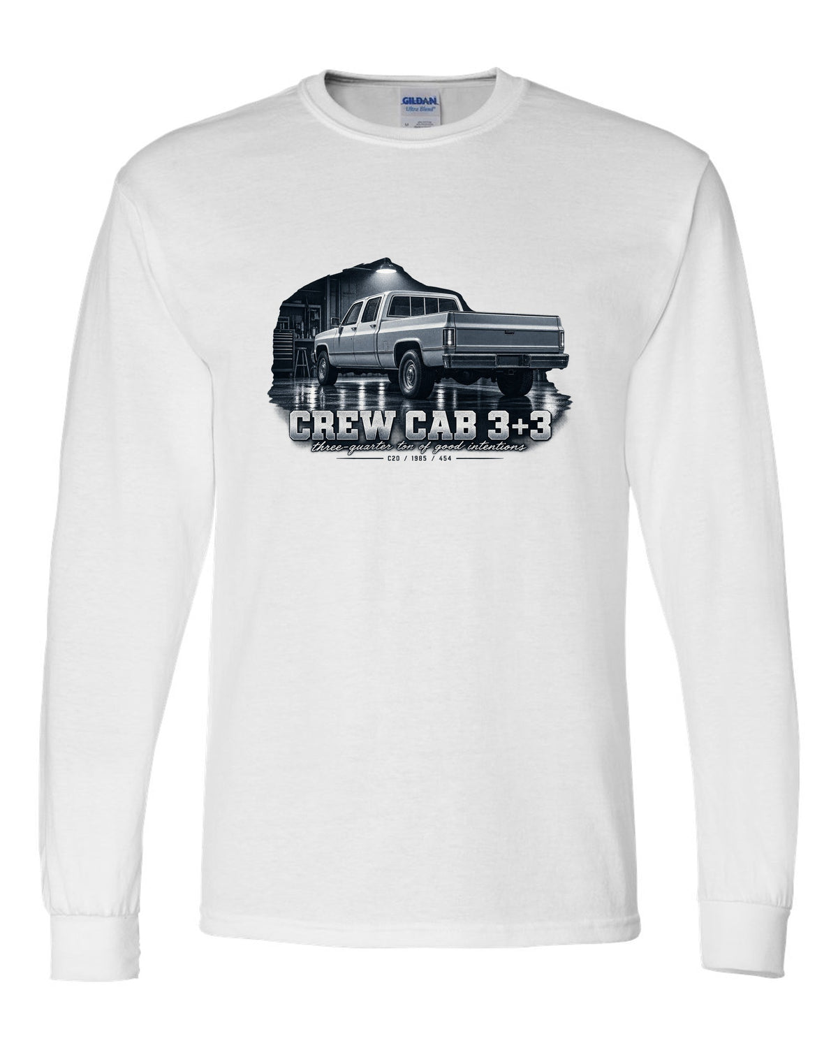 1985 C20 Squarebody crew cab in a garage night scene, print white long sleeve front view with the design
