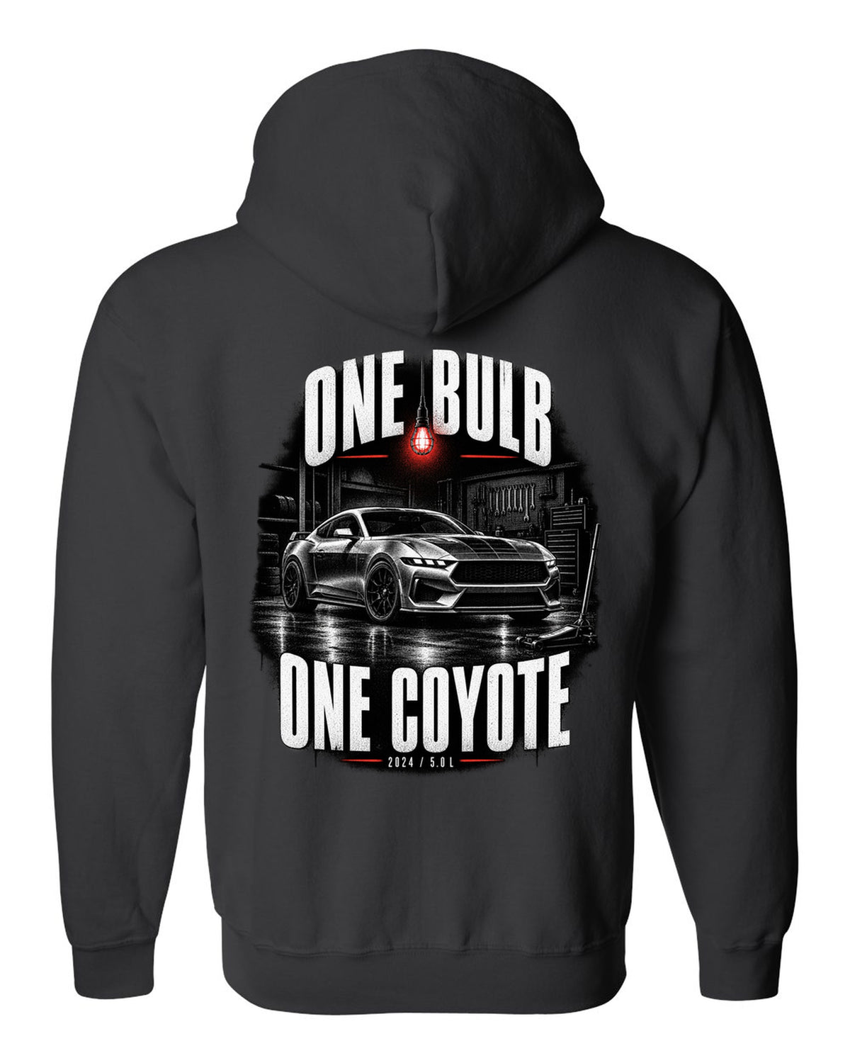 Ford Mustang S650 GT coupe in a dimly lit garage, one bulb one Coyote print black zip hoodie back view with the design