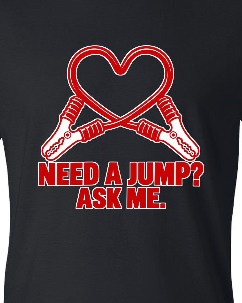 Jumper cable clamps curling into a red heart black t-shirt close-up