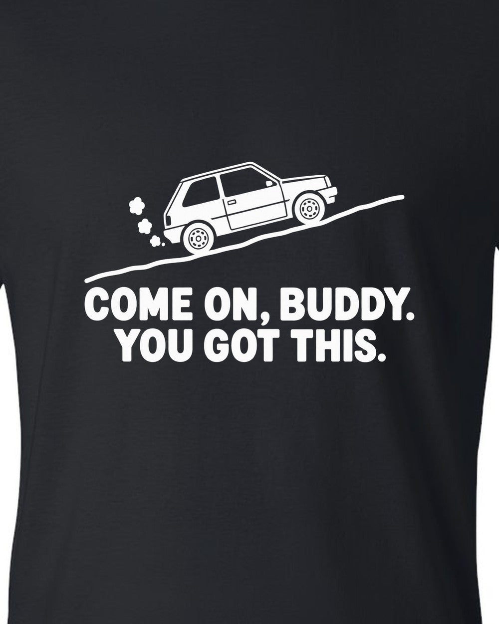 Tiny boxy car climbing a steep hill with steam puffs black t-shirt close-up