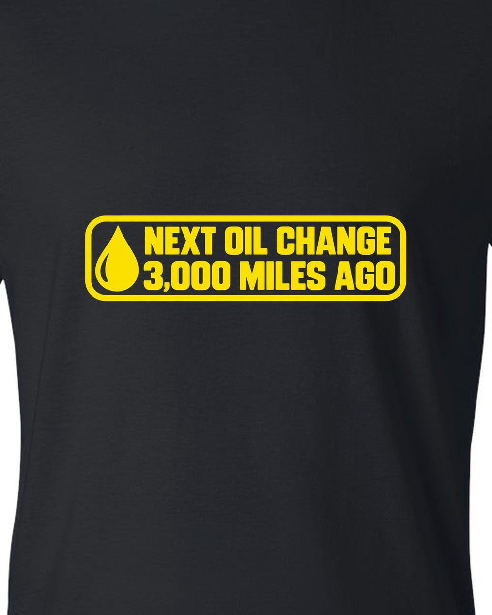 Oil change windshield sticker with oil drop in the corner black t-shirt close-up