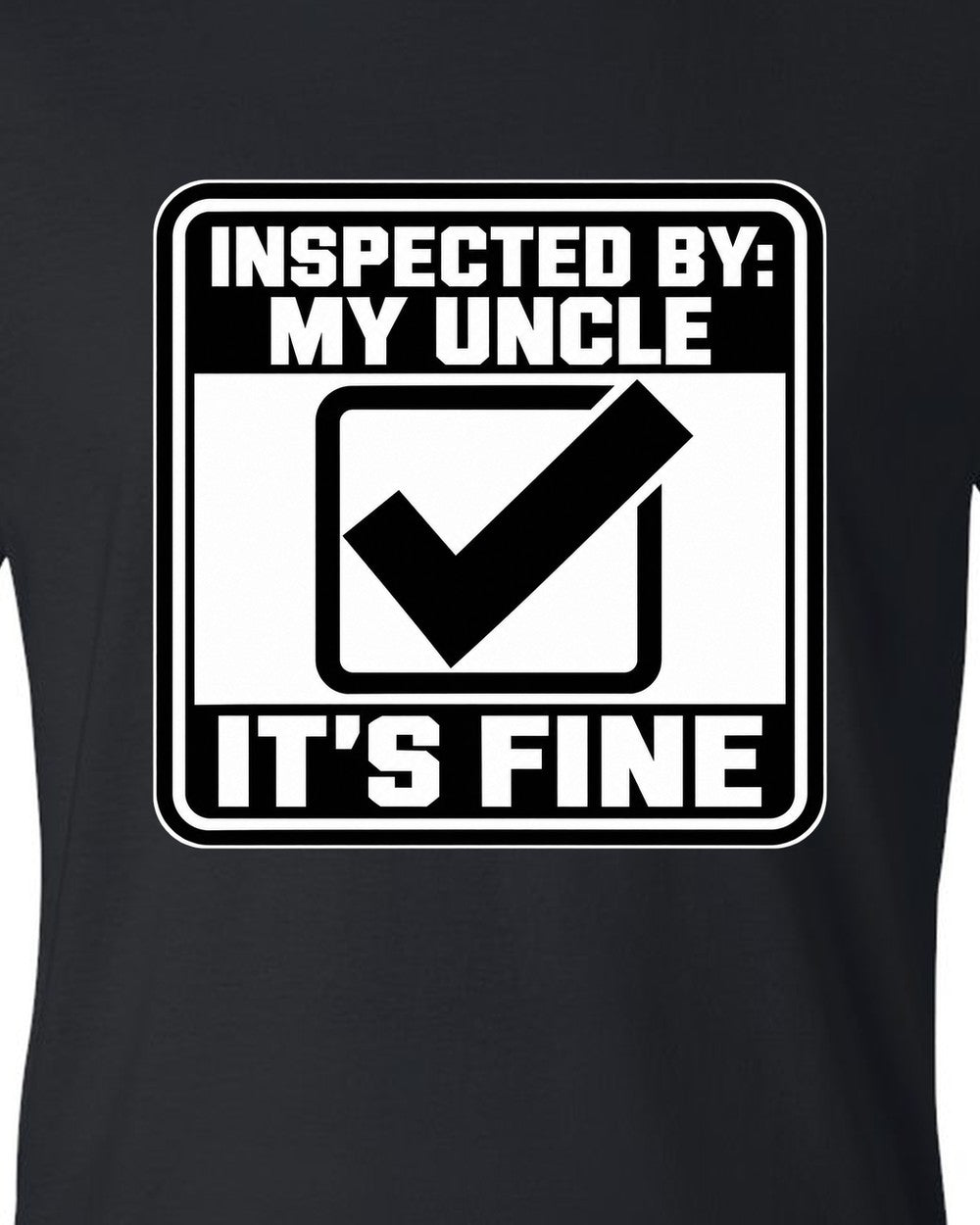 Square inspection sticker with a big check mark black t-shirt close-up