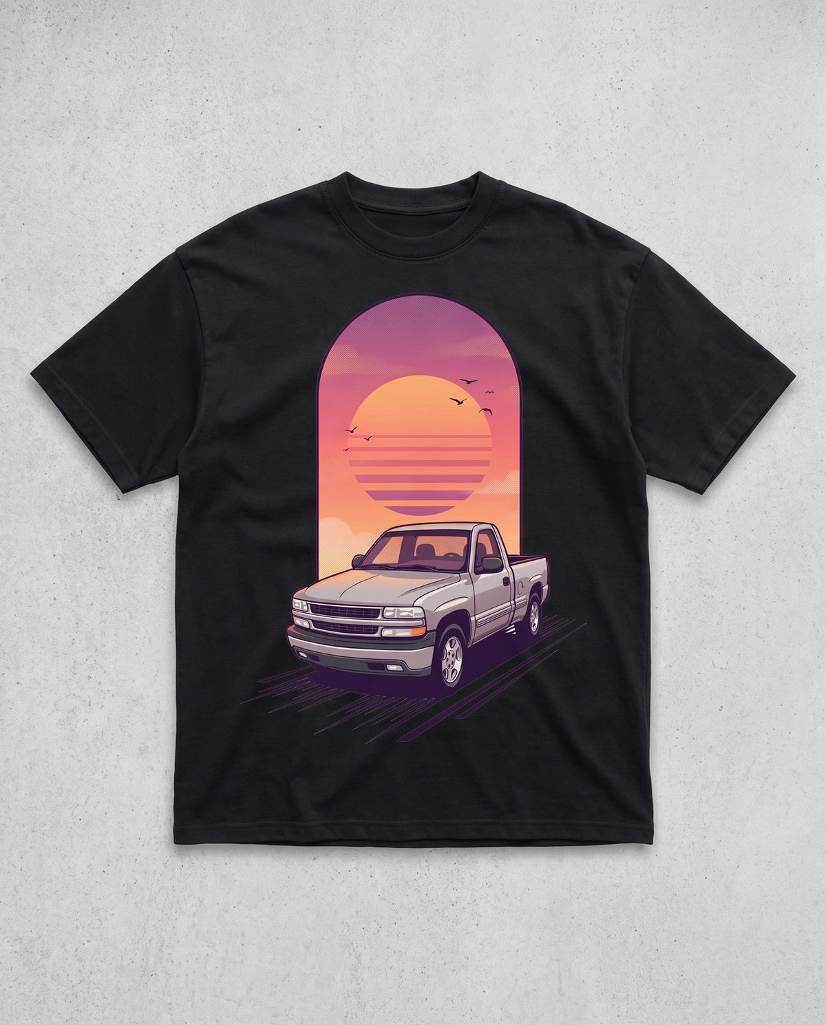 Black heavyweight tee with a tall custom sunset illustration of a customer's pickup truck