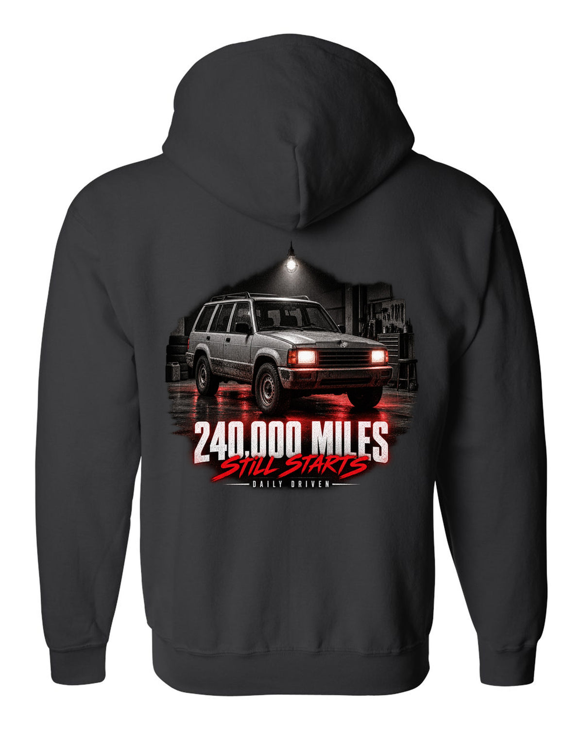 Jeep Cherokee XJ at night with daily driven 240,000 miles print black zip hoodie back view with the design