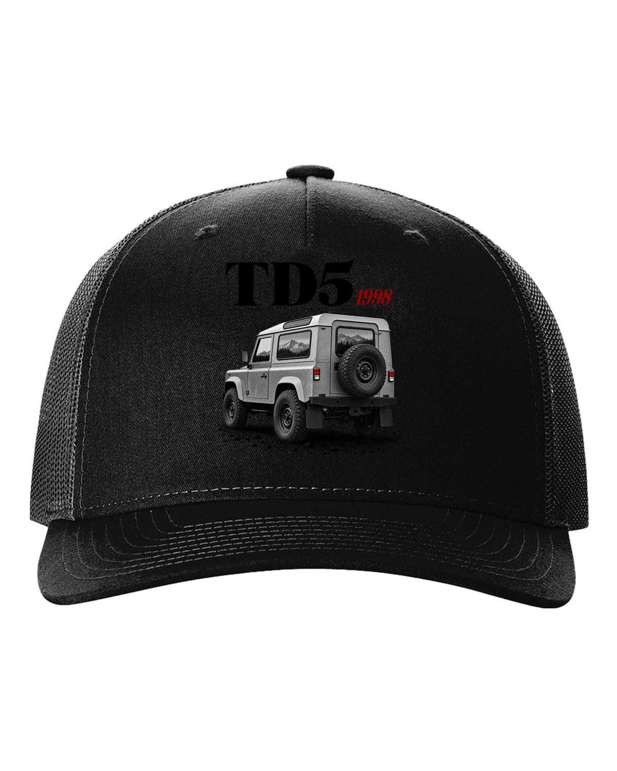 Land Rover Defender 90 editorial headline print about the 1998 Td5 engine black hat front view with the design