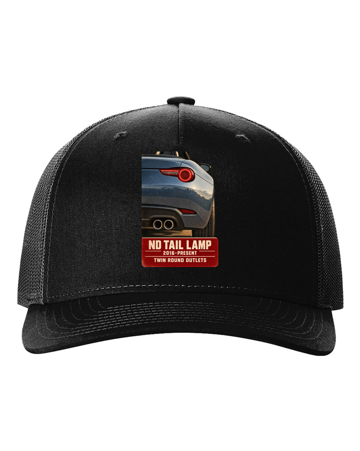 Macro poster-style print of the tail lamp and twin round exhaust outlets on a Mazda MX-5 ND black hat front view with the design