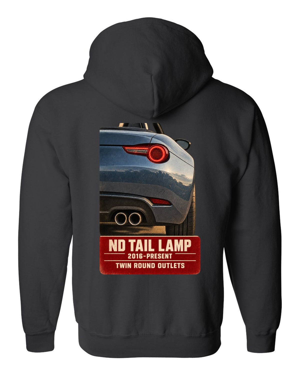 Macro poster-style print of the tail lamp and twin round exhaust outlets on a Mazda MX-5 ND black zip hoodie back view with the design