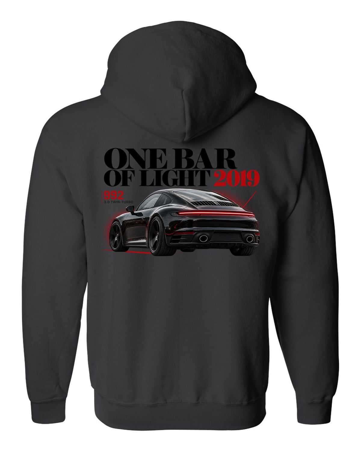 Editorial headline print of a Porsche 911 Carrera S 992 with One Bar Of Light caption black zip hoodie back view with the design