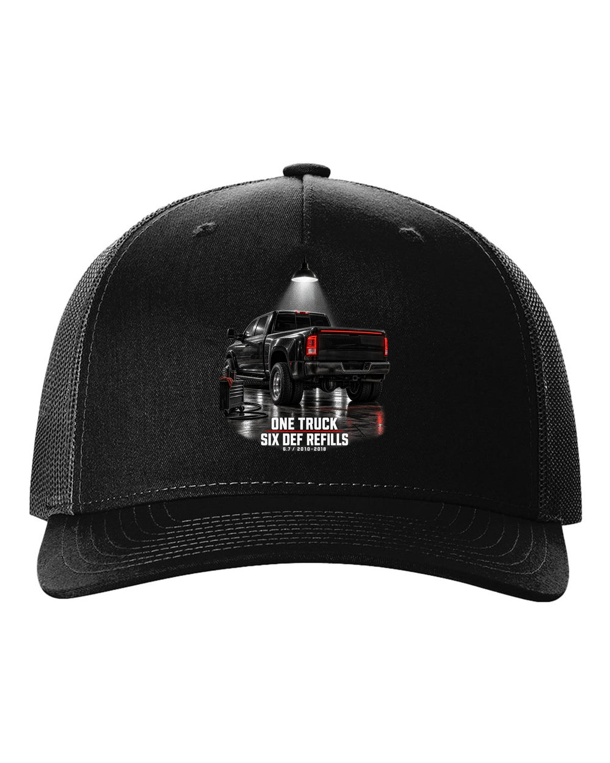 Ram 3500 4th gen dually 6.7 in a night garage with the text One truck, six DEF refills black hat front view with the design