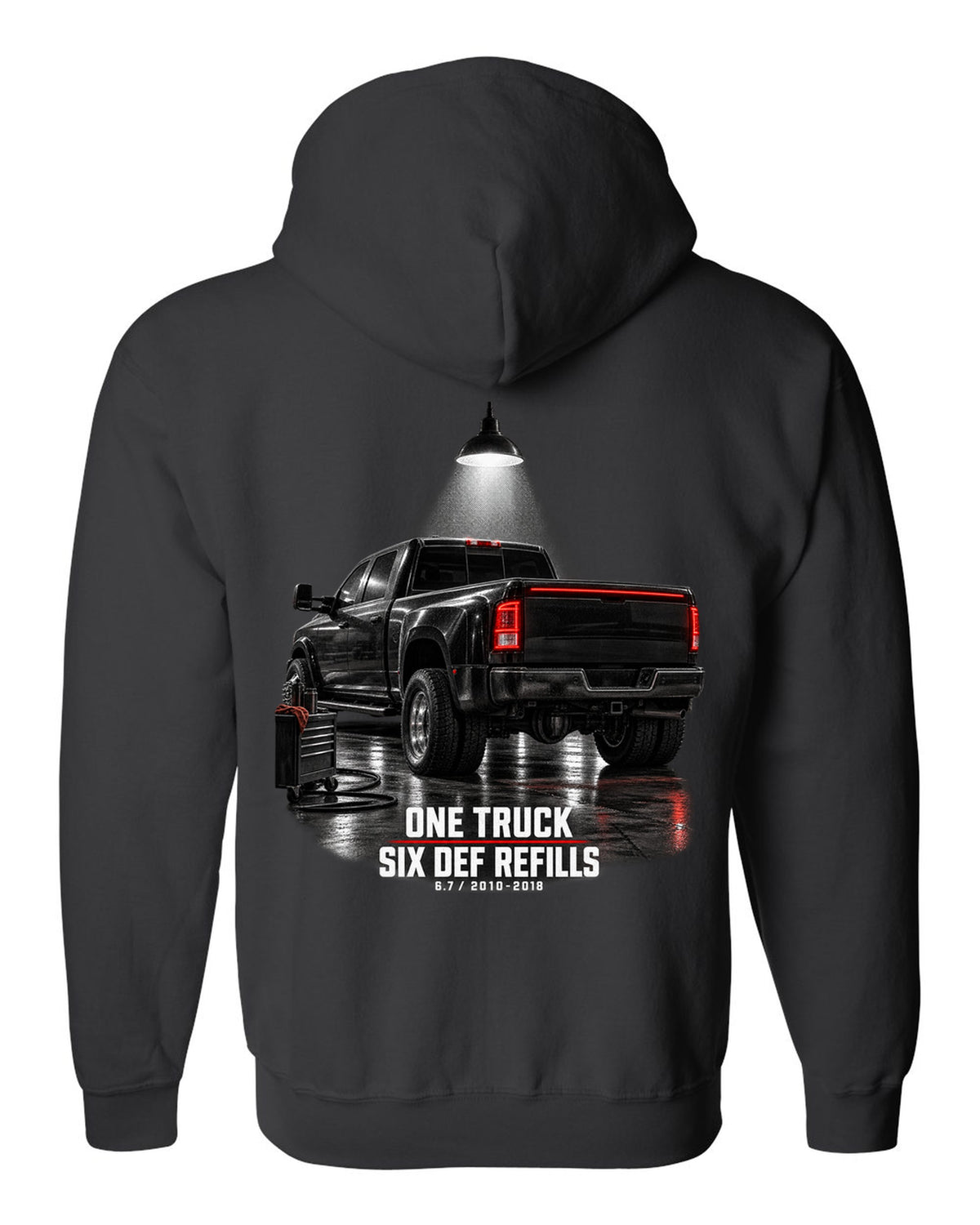 Ram 3500 4th gen dually 6.7 in a night garage with the text One truck, six DEF refills black zip hoodie back view with the design