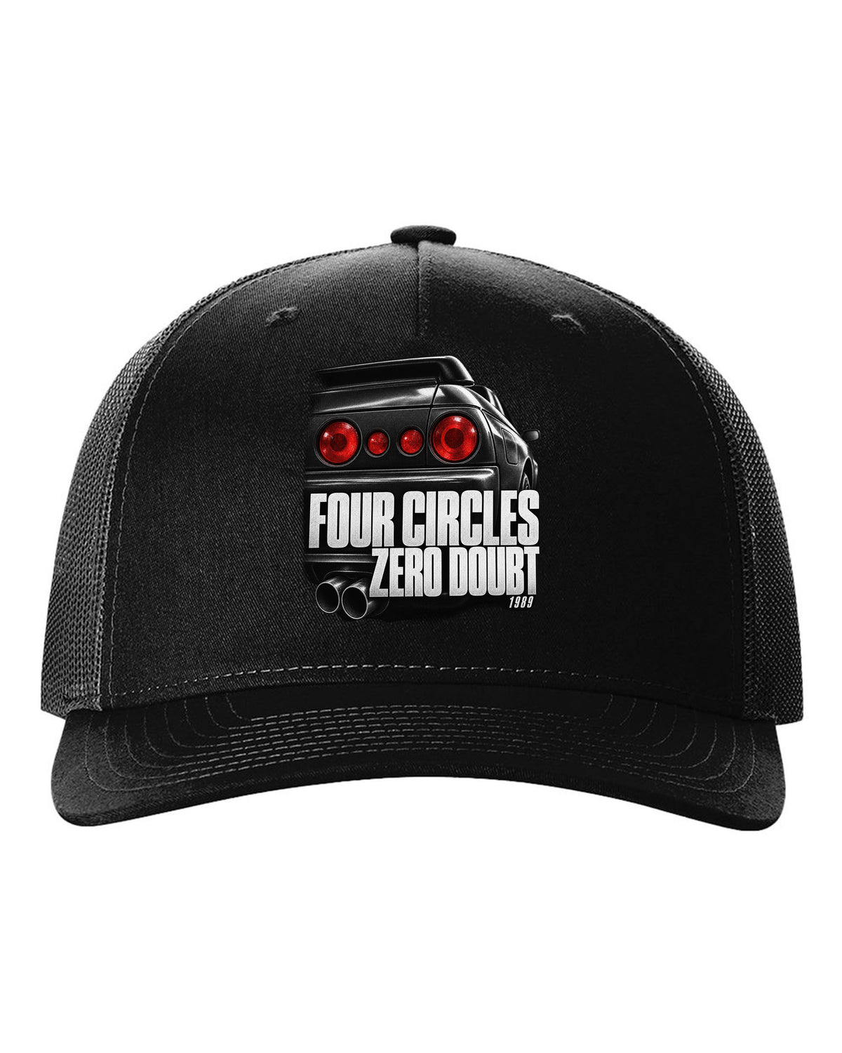 Close-up macro of the round taillights on a Nissan Skyline GT-R R32 with four circles lettering black hat front view with the design
