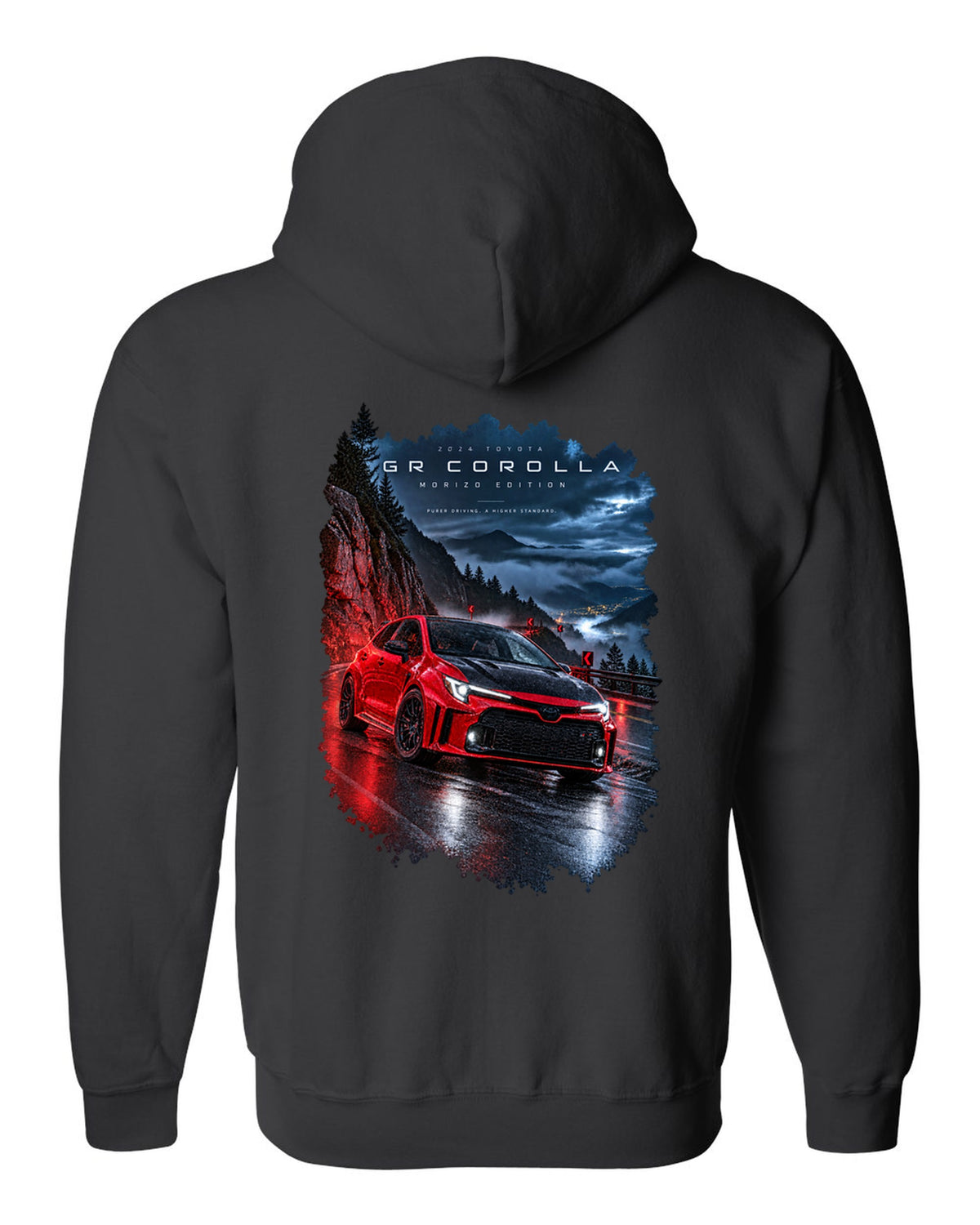 Toyota GR Corolla Morizo Edition on a wet mountain road at night black zip hoodie back view with the design
