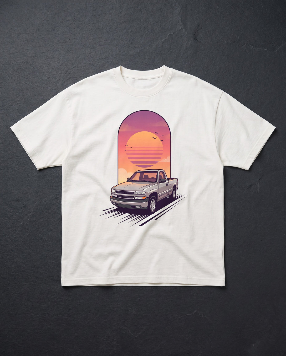 White heavyweight tee with a tall custom sunset illustration of a customer's pickup truck